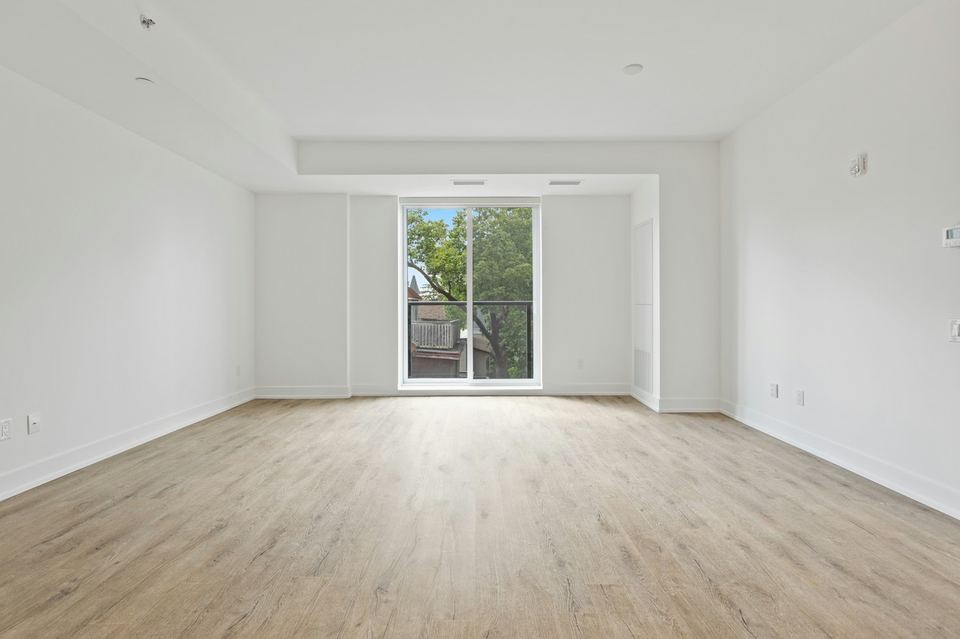 Before: photo of an empty living room with a wood floor and a tall window